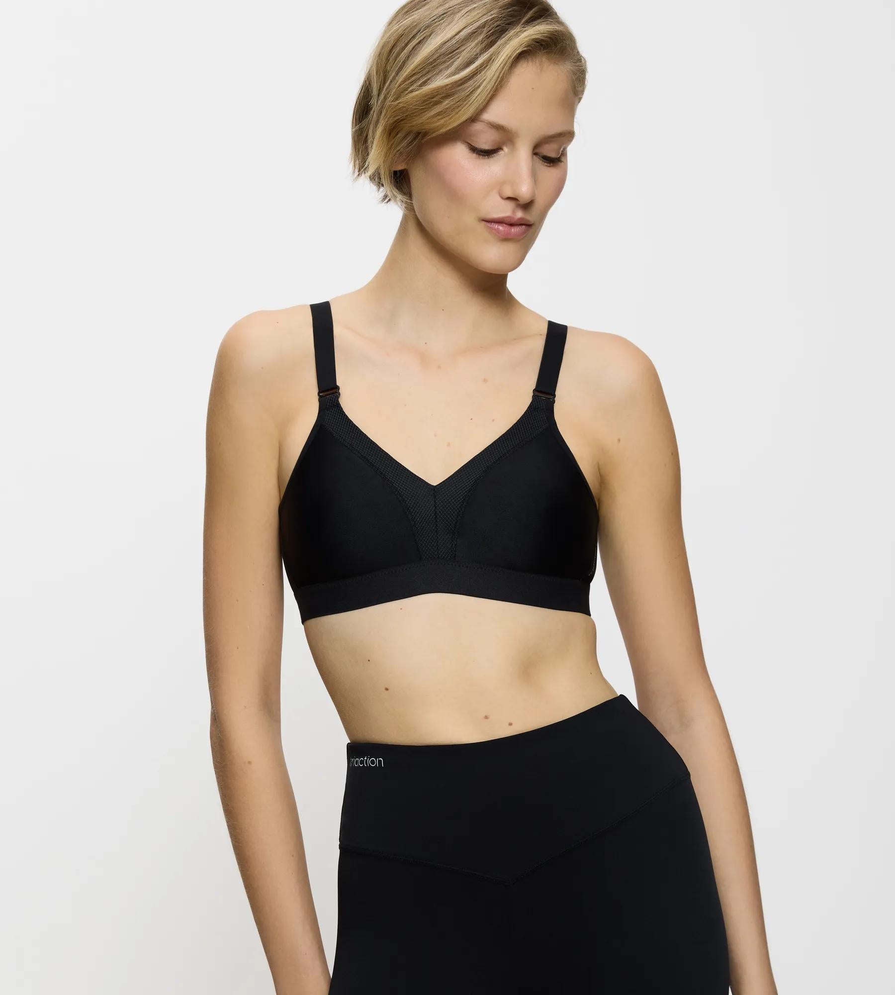 Triaction Wellness wireless bra in black, designed for yoga and Pilates with high support and breathable fabric.