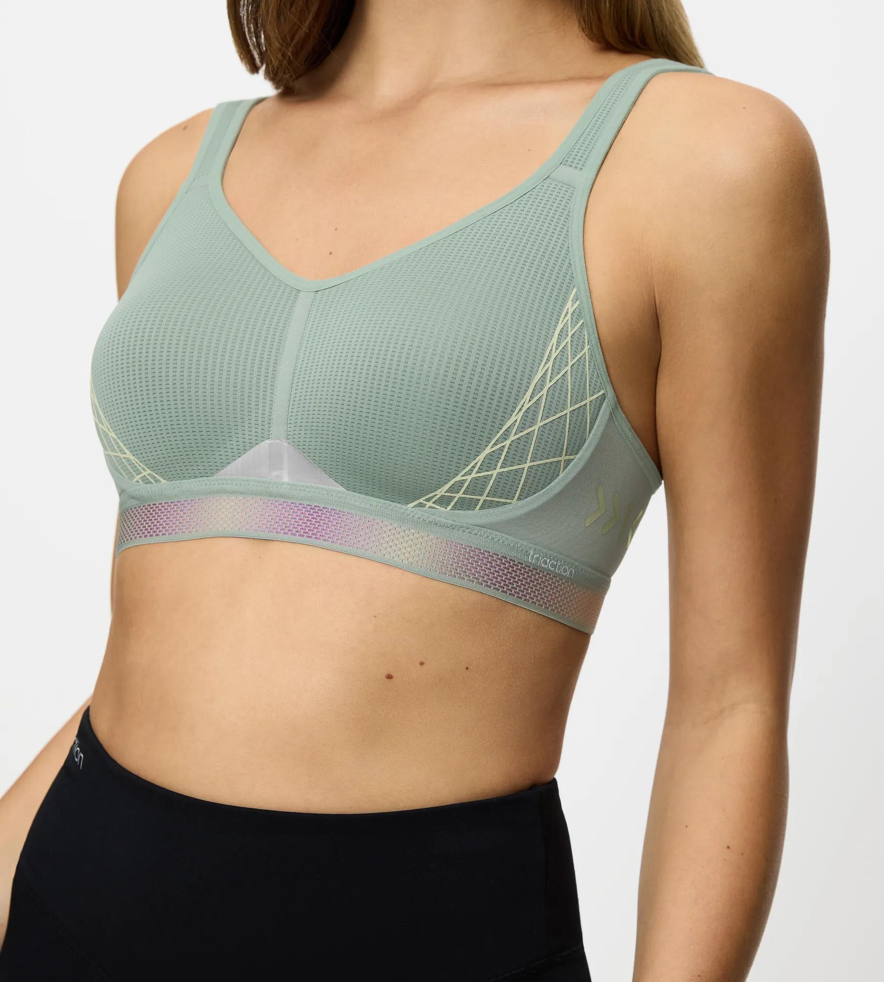 Triaction Cardio Flow sports bra in green, featuring padded straps and seamless design for maximum workout support.