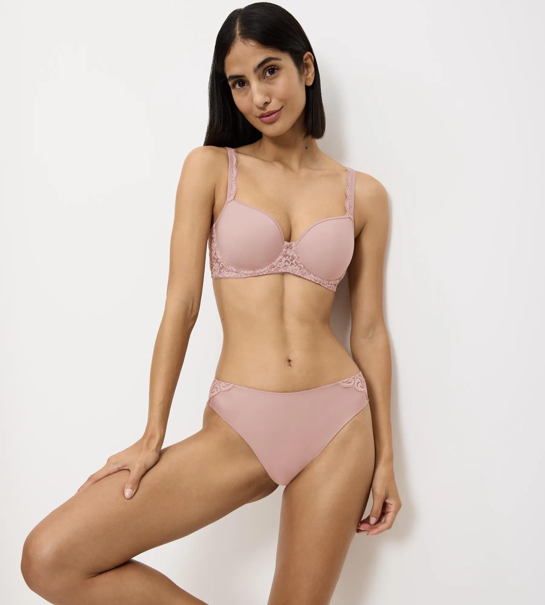 Amourette ergonomic bra and panty set in soft pink, designed for comfort and a flattering fit, showcasing modern scoop back style.