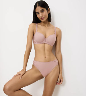 Amourette ergonomic bra and panty set in soft pink, designed for comfort and a flattering fit, showcasing modern scoop back style.