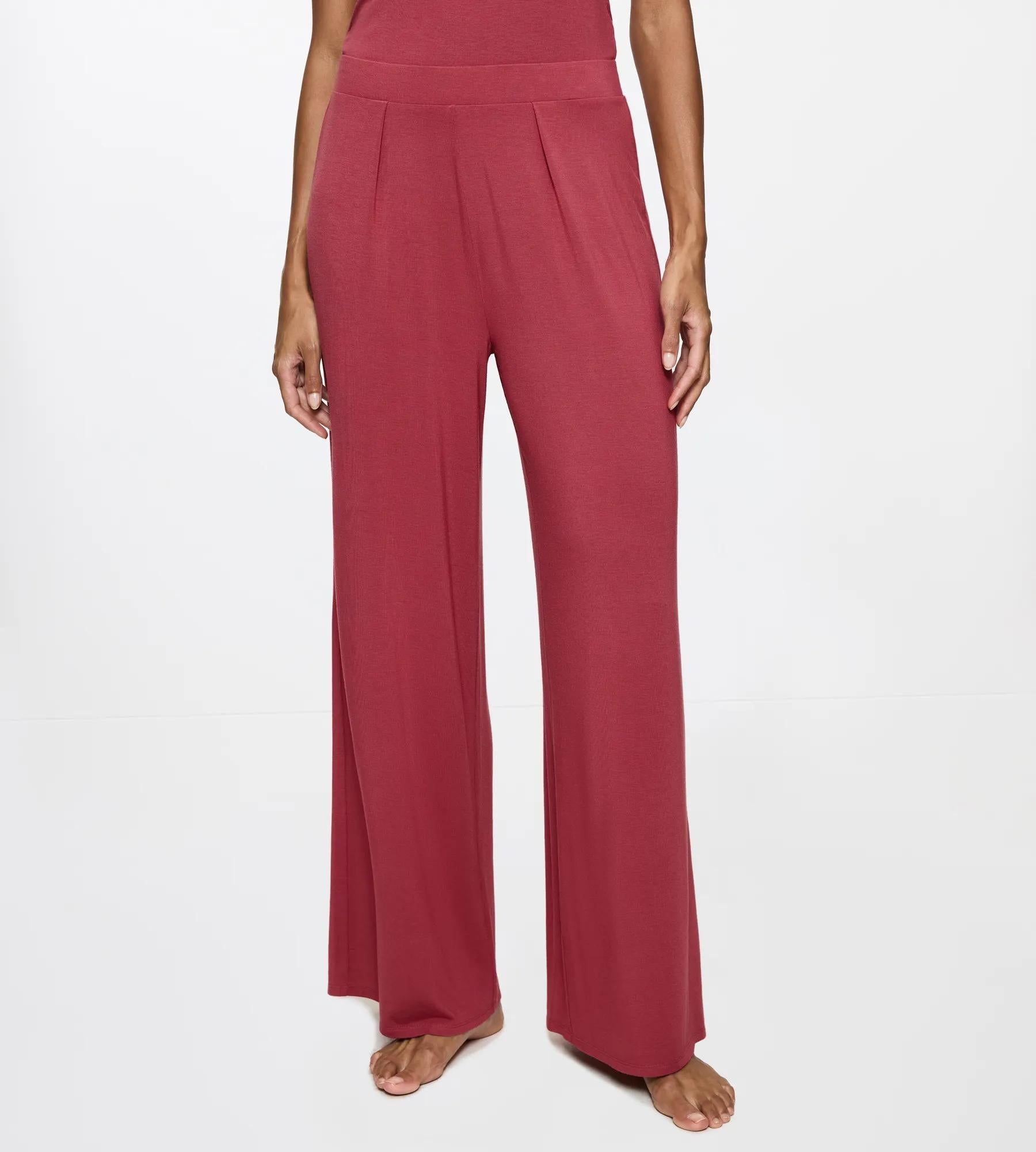 Aura Spotlight wide leg trousers featuring soft pleats for a flattering fit and comfortable waistband.
