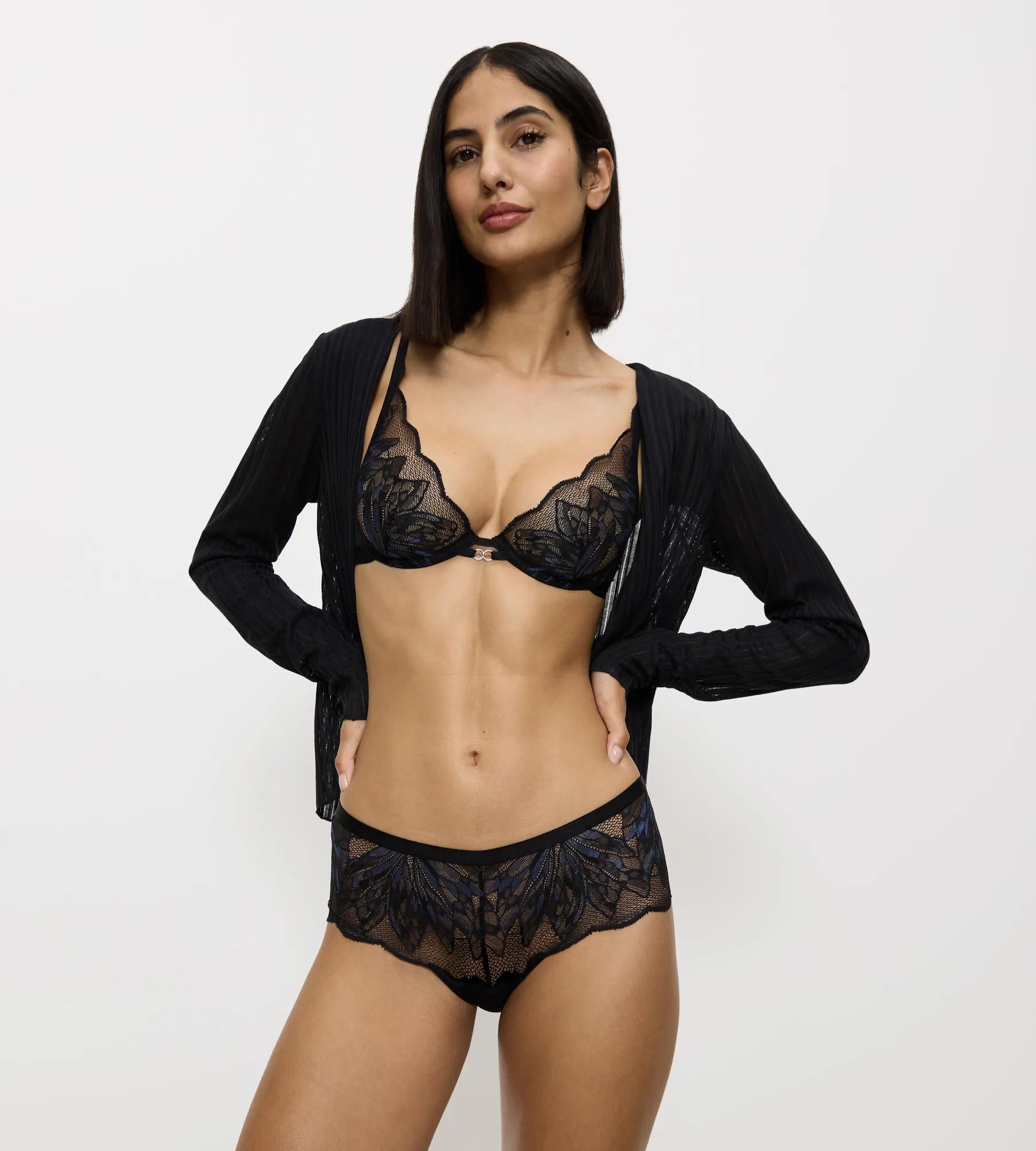 Model wearing Crazy Stupid Love black lace and mesh underwear set with embroidered detail.