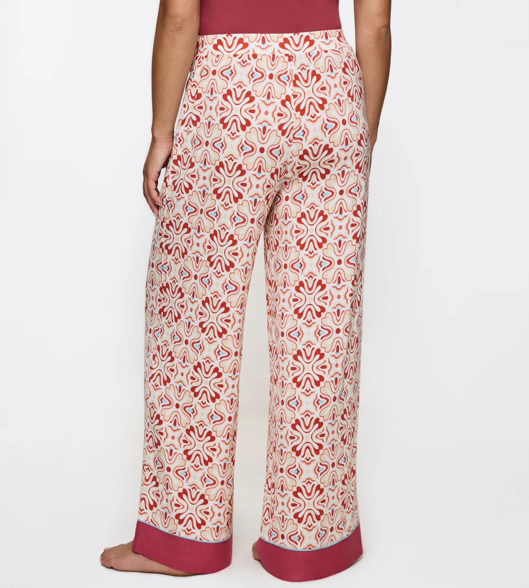 Aura Spotlight wide-leg trousers featuring a floral pattern and comfortable waistband, perfect for casual outings.