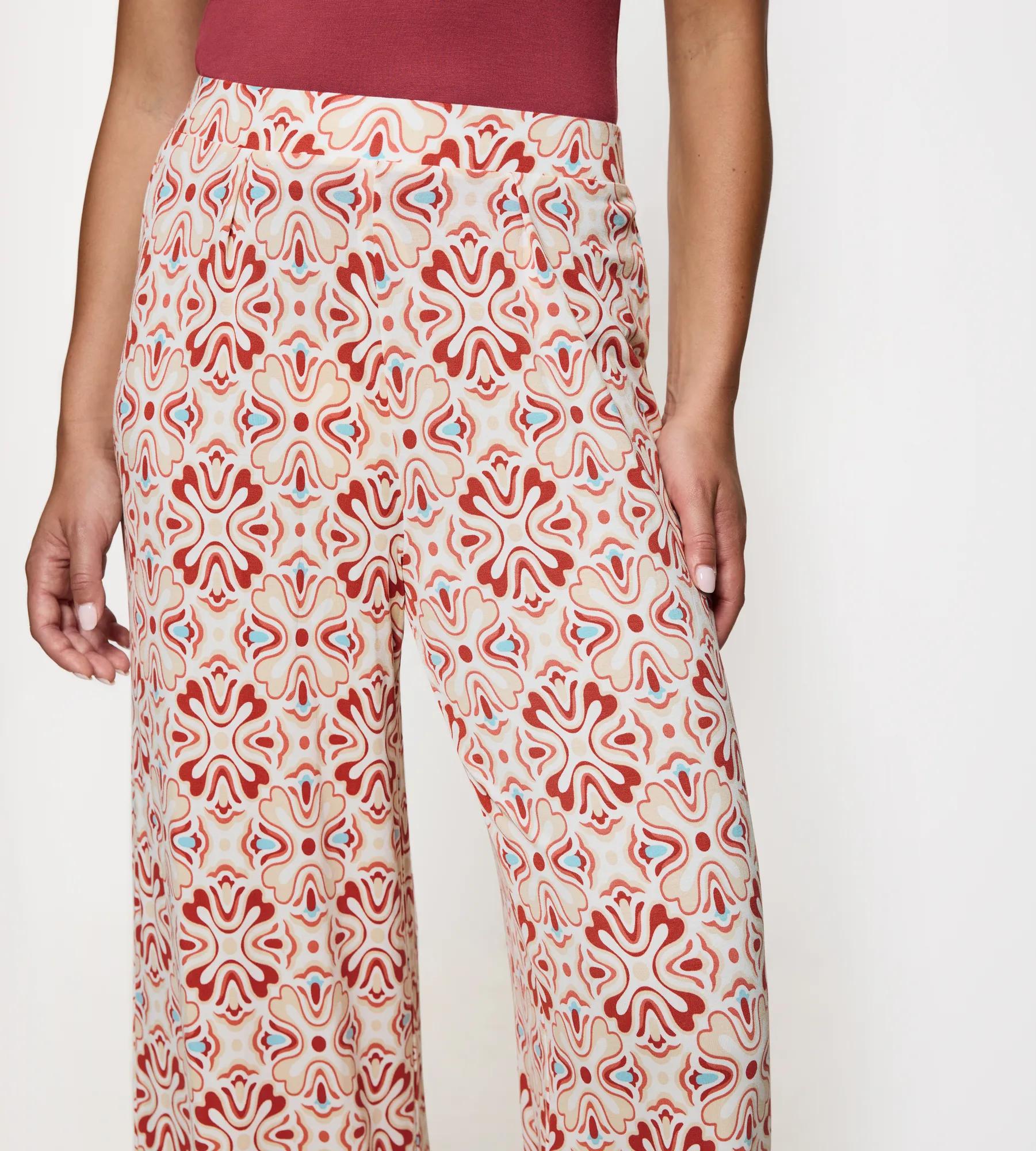 Aura Spotlight wide-leg trousers featuring a colorful, abstract pattern, perfect for casual weekend outings.