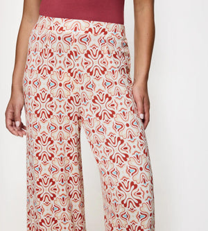 Aura Spotlight wide-leg trousers featuring a colorful, abstract pattern, perfect for casual weekend outings.