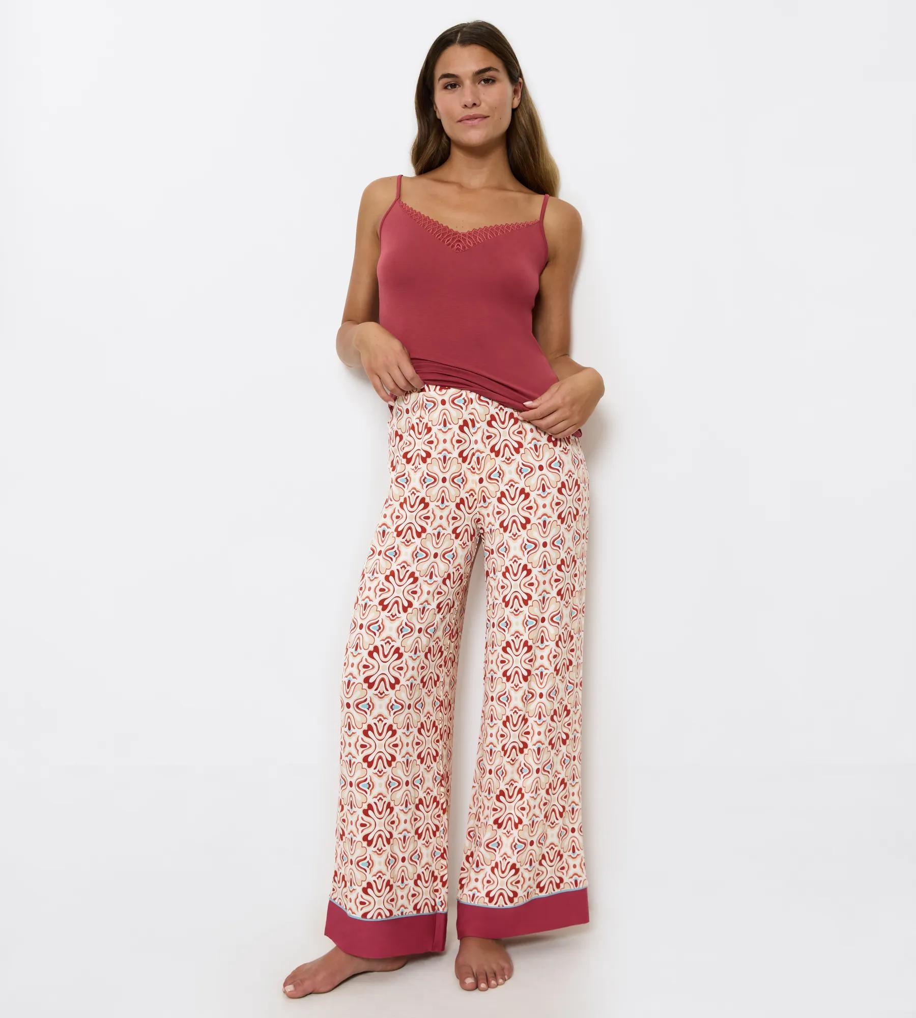 Woman wearing Aura Spotlight wide-leg trousers with soft pleats and comfortable waistband, perfect for weekend outings.