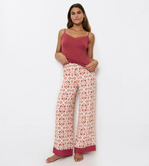 Woman wearing Aura Spotlight wide-leg trousers with soft pleats and comfortable waistband, perfect for weekend outings.