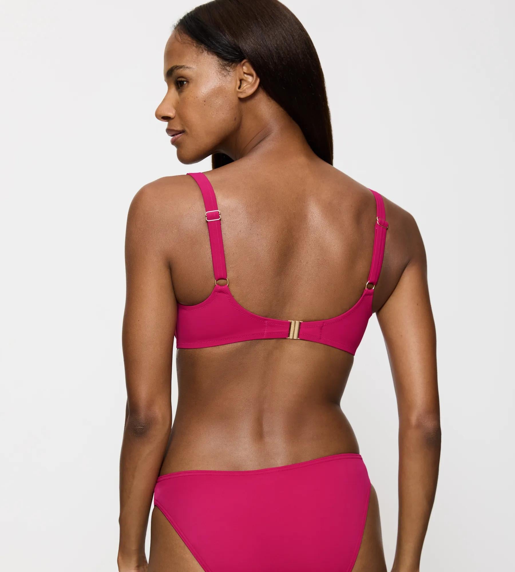 Summer Twist bikini top in vibrant pink, showcasing adjustable straps and a comfortable fit from the back view.