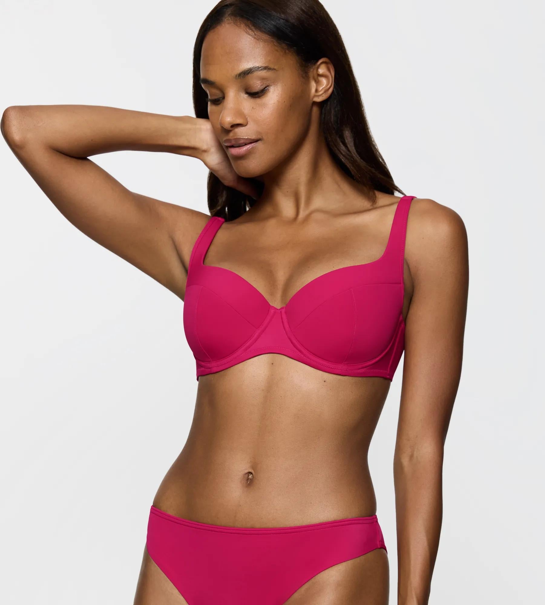 Model wearing a pink padded bikini top from the Summer Twist collection.