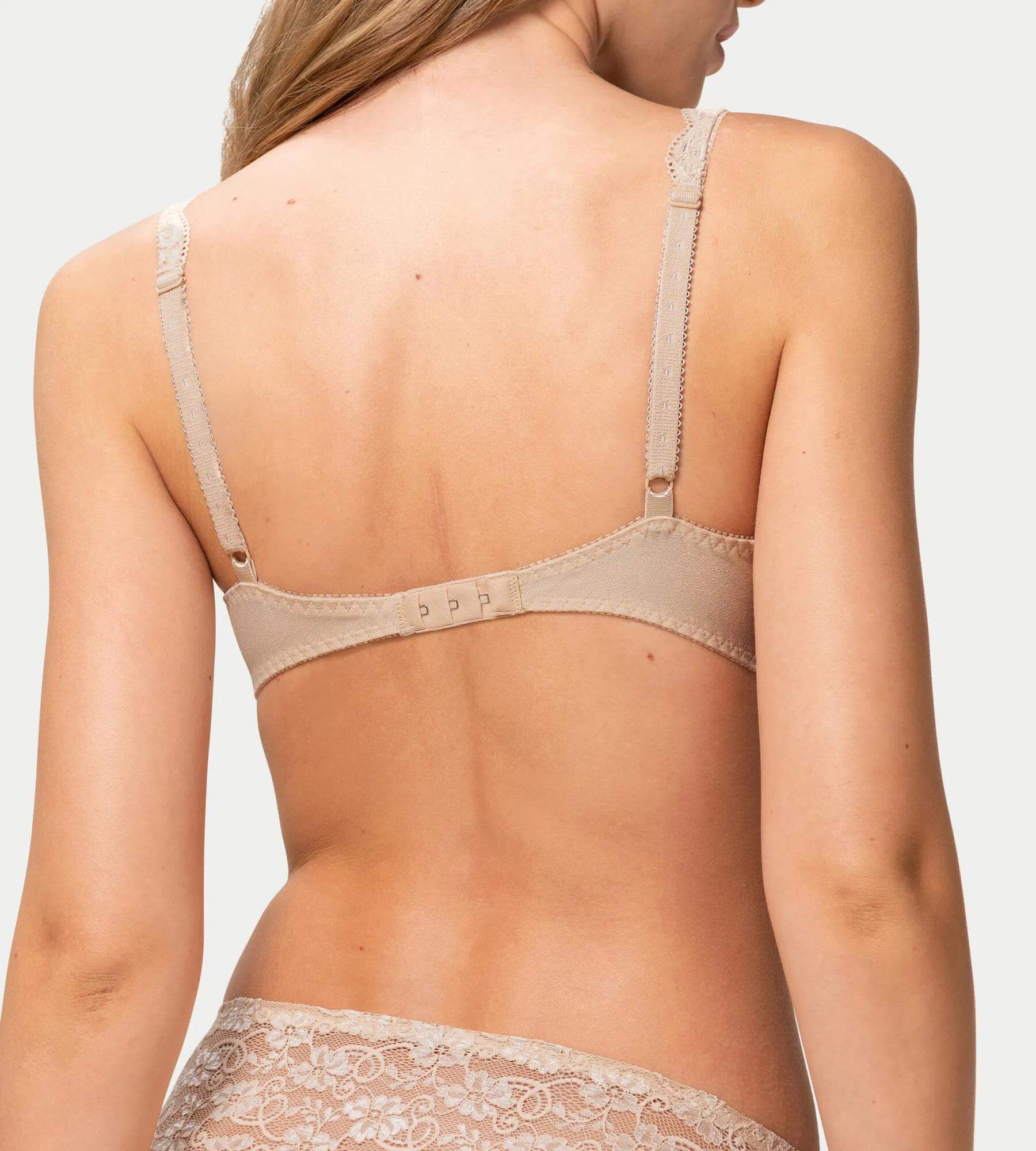 Back view of Amourette 300 skin bra showing lace details and adjustable straps.