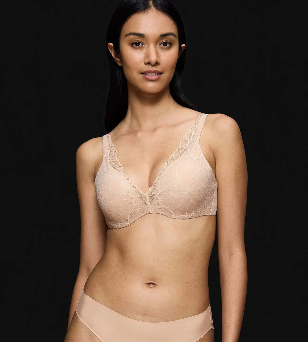 Model wearing Triumph Body Make-Up Illusion comfort-wire lace bra
