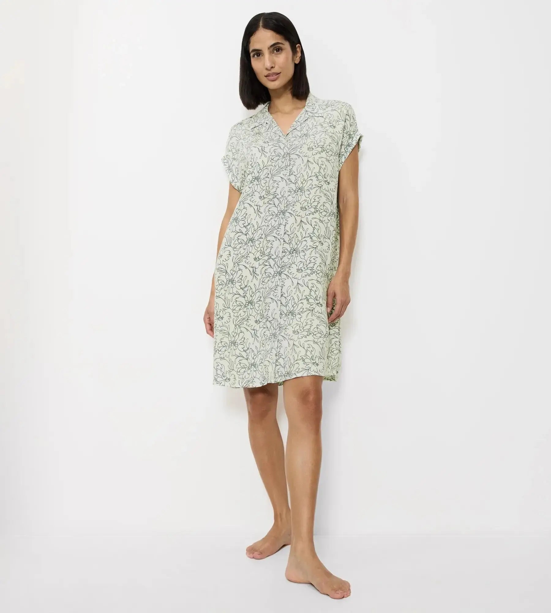 Woman wearing a Boyfriend Fit short-sleeved nightdress with a relaxed fit and modern dropped shoulders.