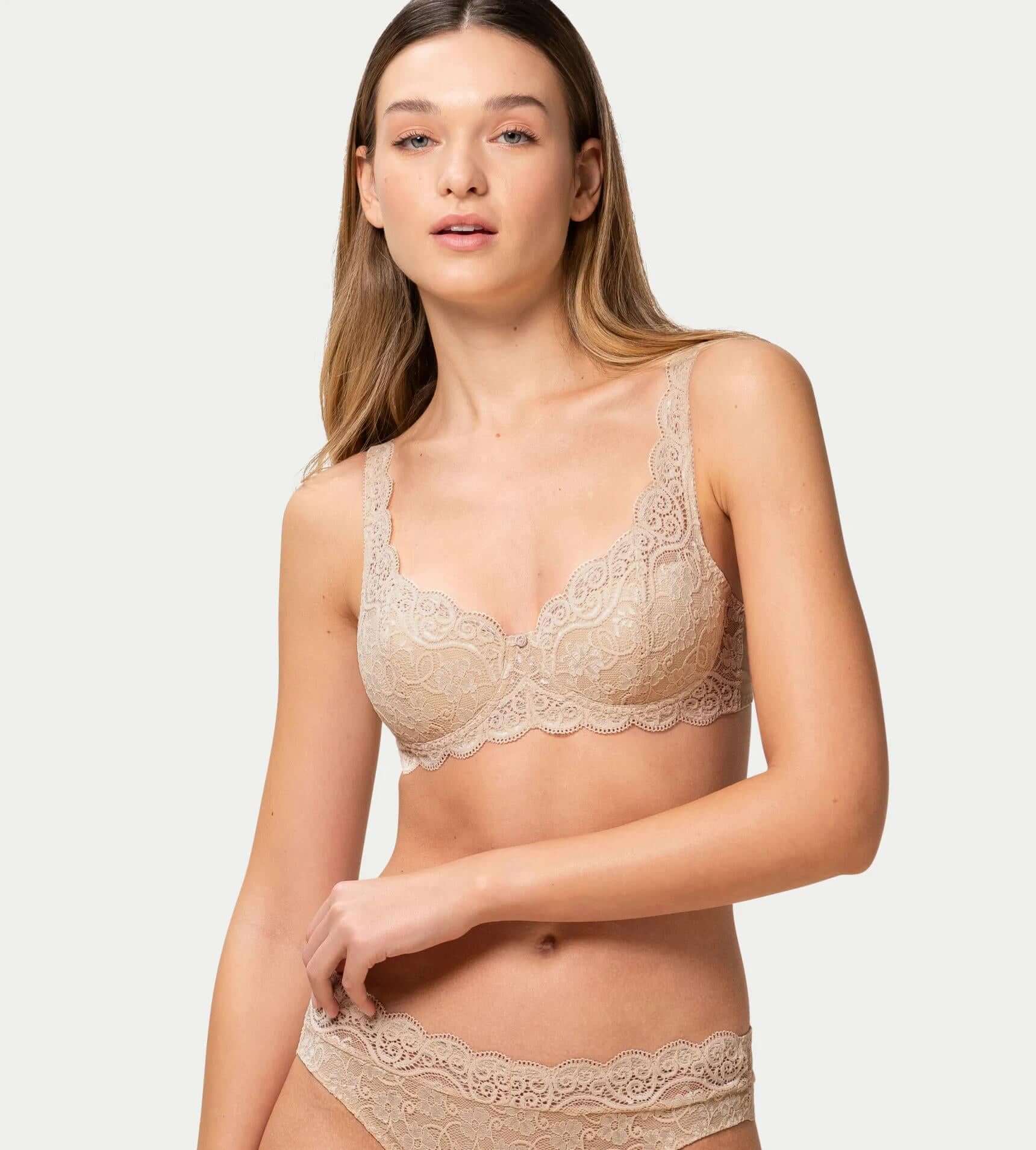 Model wearing Amourette 300 skin lace bra with soft padded cups and floral embroidery.