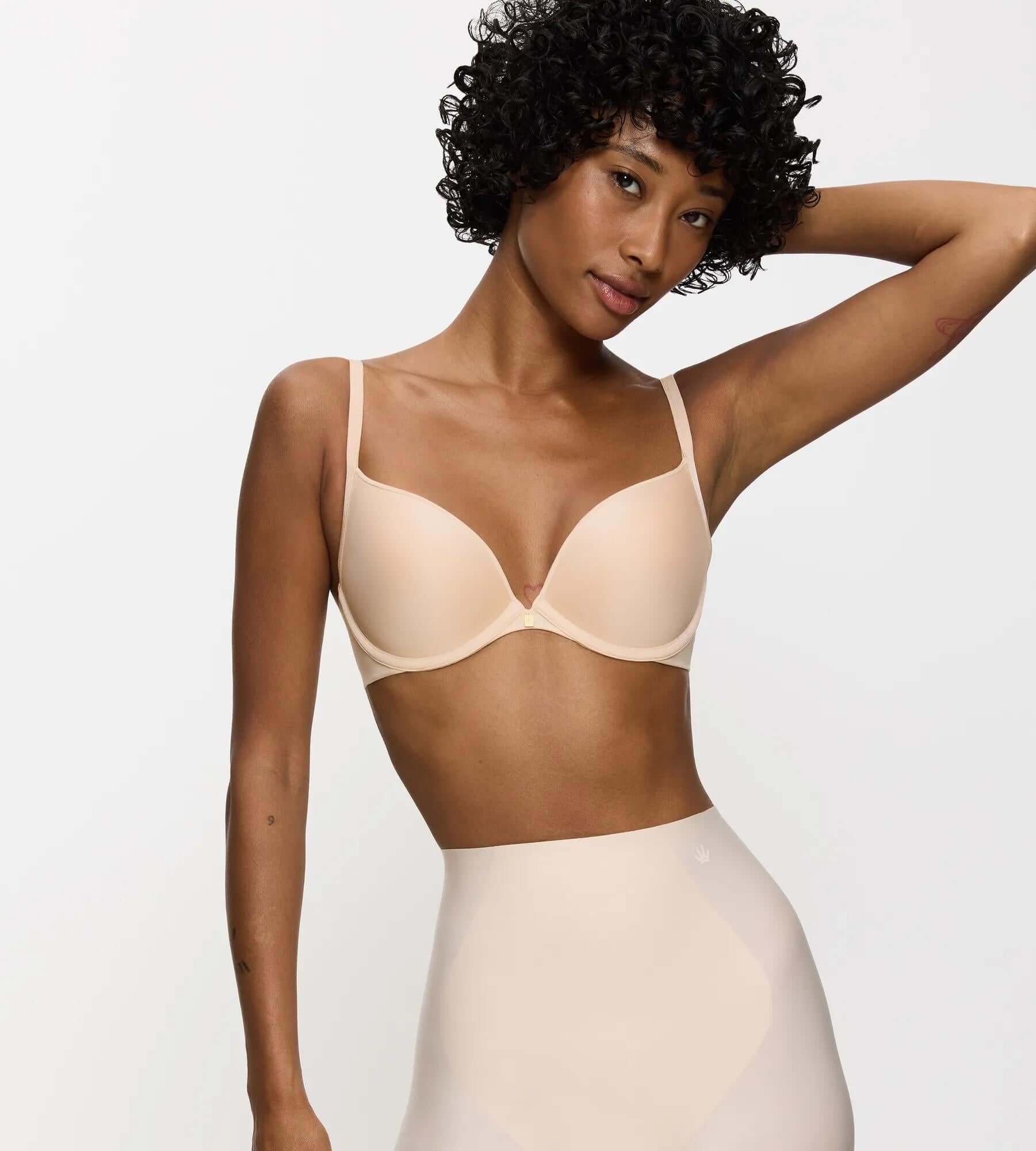 Model showcasing Body Make-Up Essentials push-up bra with padded cups and adjustable straps.