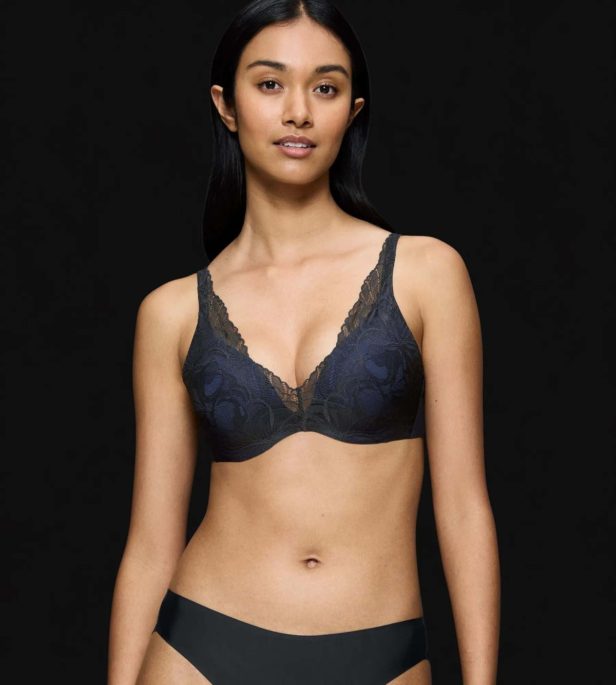 Model wearing Body Make-Up Illusion Lace bra, showcasing the illusion of support without the bulk of a traditional bra.